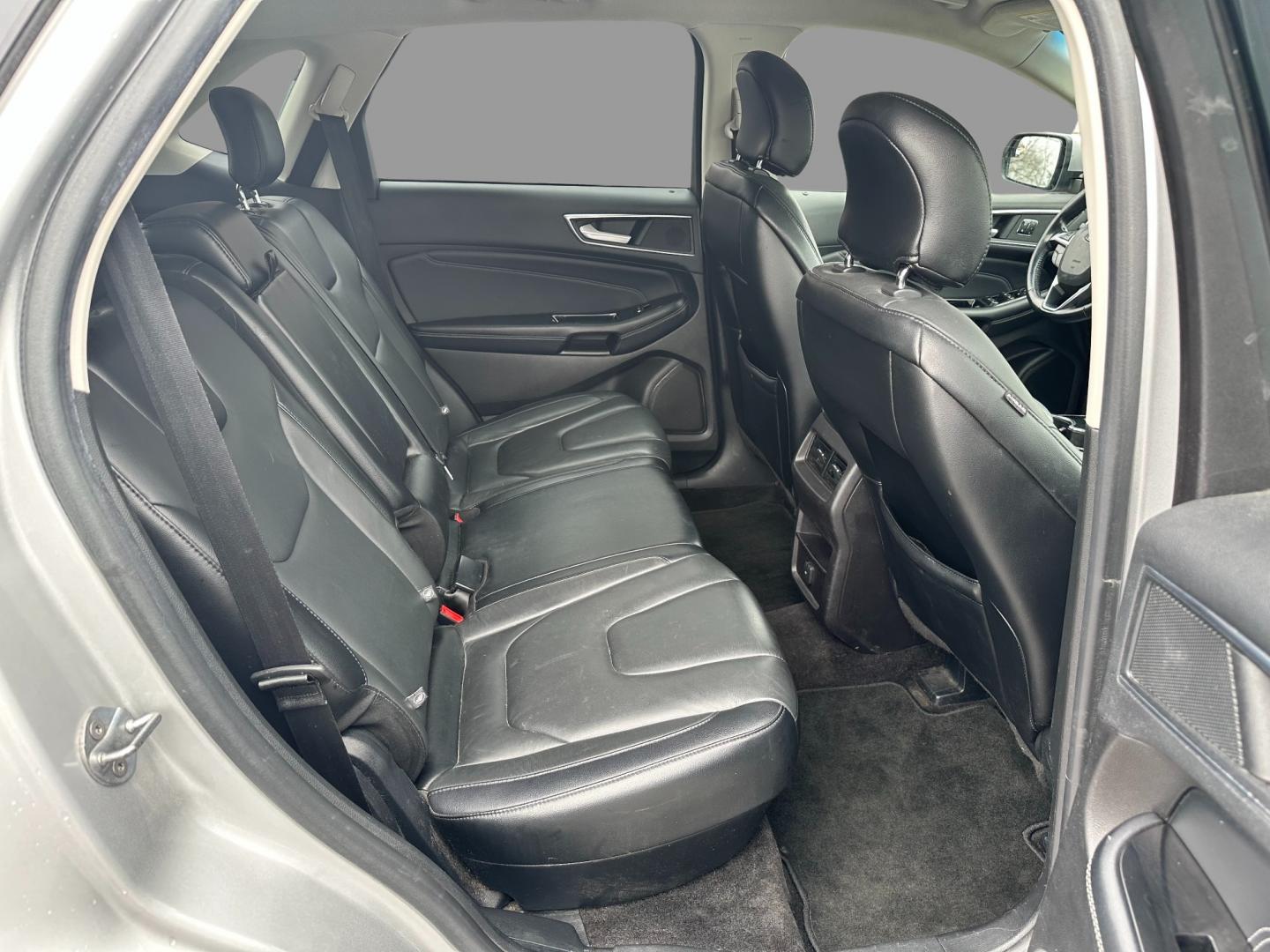 2017 Silver /Black Ford Edge Titanium (2FMPK4K92HB) with an 2.0L I4 DOHC 16V Turbo engine, 6-Speed Automatic transmission, located at 547 E. Main St., Orwell, OH, 44076, (440) 437-5893, 41.535435, -80.847855 - This 2017 Ford Edge Titanium AWD is a well-equipped midsize SUV. It comes with a powerful yet efficient 2.0L EcoBoost engine paired with a smooth 6-speed automatic transmission. Notable features include LED daytime running lights, dusk-sensing headlights, leather interior, auto-dimming rearview mirr - Photo#40